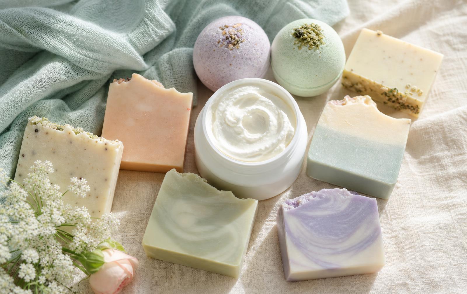 Soft n Smelly soap bars, bath bombs and body butter on cream linen